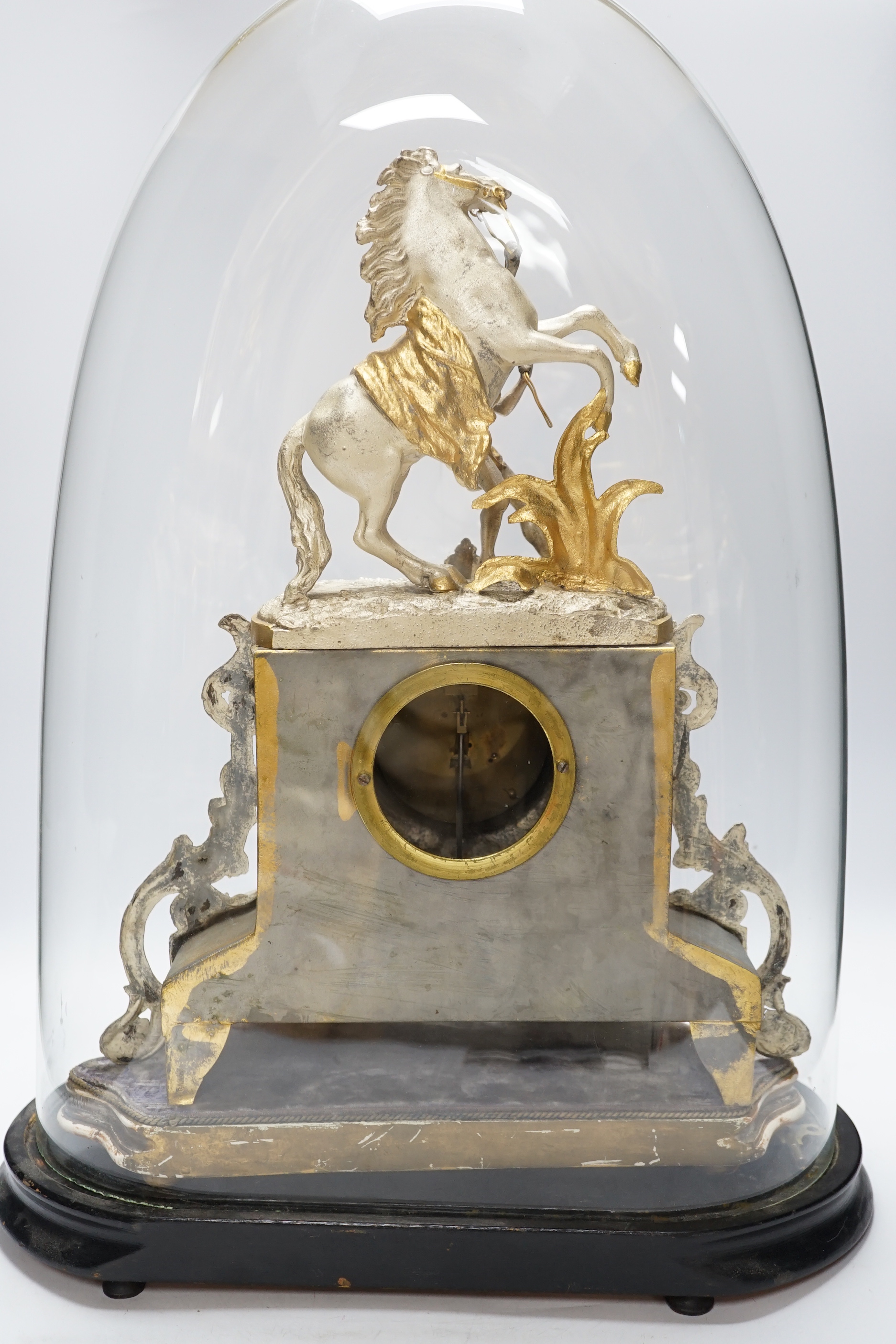 A French gilt and silvered ‘Marly Horse’ mantel clock under (cracked) dome, total height 57cm